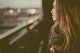 Girl overlooking a metropolitan city